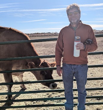 John at a farmed animal sanctuary